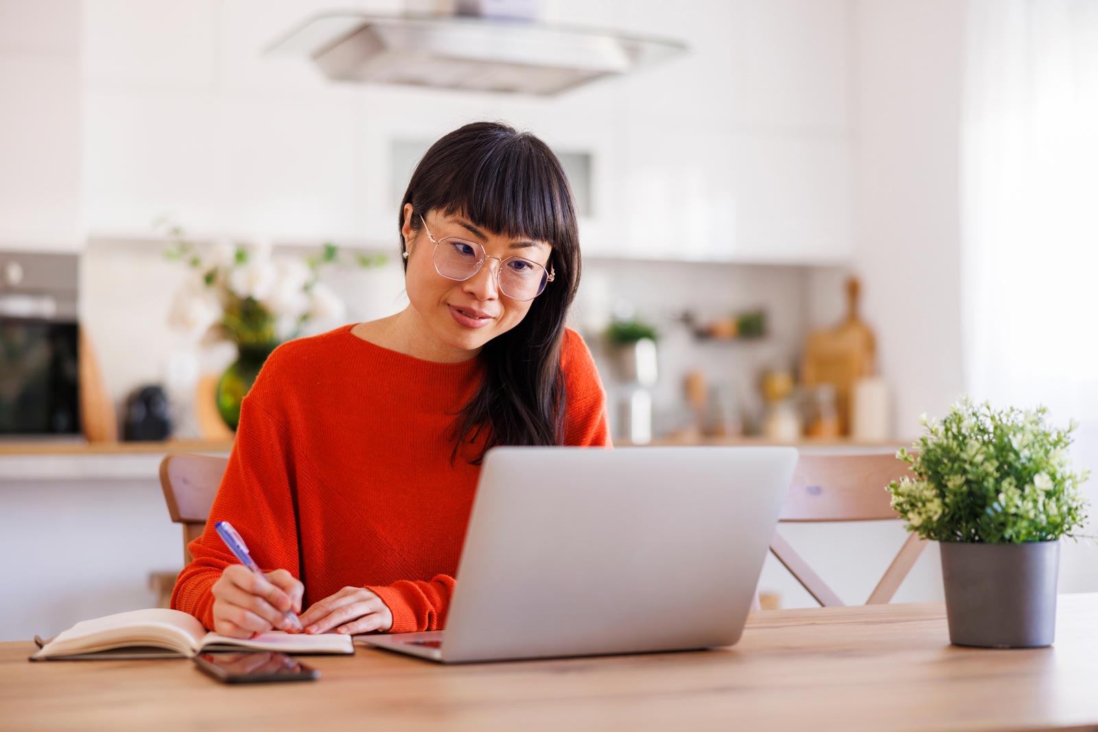 Woman working in front of a laptop